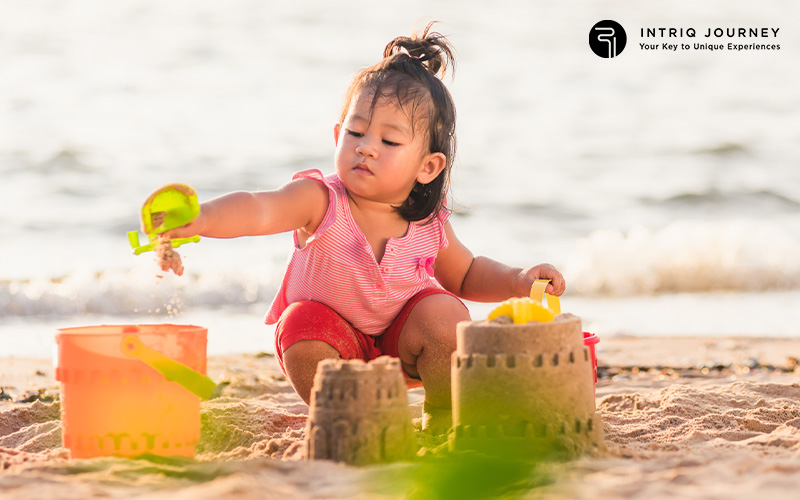 Child Playing At The Beach