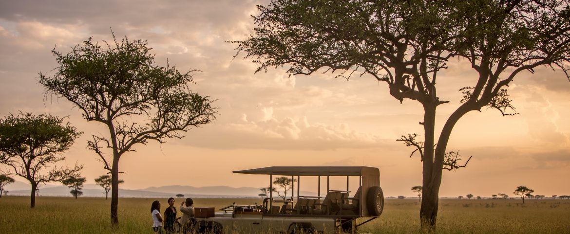 Scenery outside singita luxury lodge with a safari vehicle.