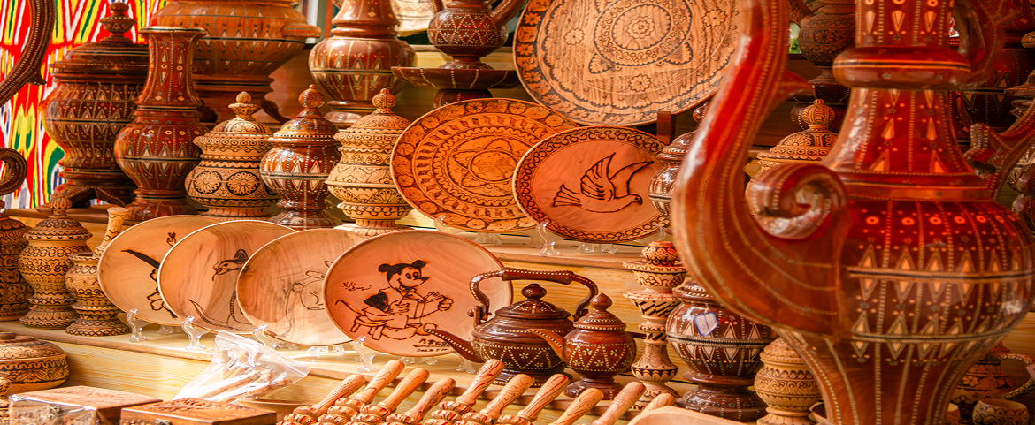 Handcrafted traditional Xinjiang pottery and plates with intricate patterns.