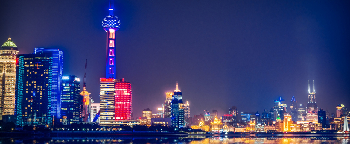 Shanghai skyline and Oriental Pearl Tower at night.