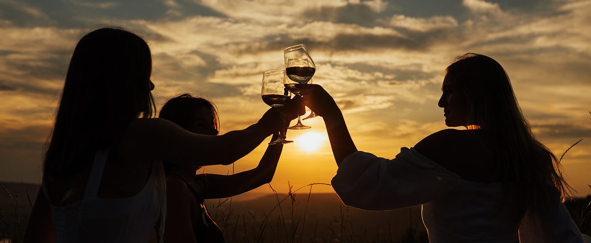 Travelers enjoying a sunset wine tasting on Intriq Journey.